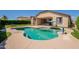 Enjoy the backyard swimming pool with ample room for entertaining at 18003 W Carmen Dr, Surprise, AZ 85388
