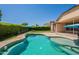 An inground pool is part of the backyard and is perfect for hot days at 18003 W Carmen Dr, Surprise, AZ 85388