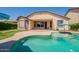 A private swimming pool is the focal point of the backyard at 18003 W Carmen Dr, Surprise, AZ 85388