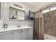 Clean bathroom with a shower, vanity, and ample storage at 18016 N 145Th Ave, Surprise, AZ 85374