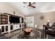 Comfortable living room features vaulted ceiling, french doors, stylish decor, and comfortable seating at 18016 N 145Th Ave, Surprise, AZ 85374