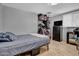 A simply furnished bedroom features modern flooring and ample storage, providing a comfortable and functional space at 1815 E Illini St, Phoenix, AZ 85040