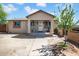 Charming single-story home featuring a covered porch, desert landscaping, and a welcoming entrance at 1815 E Illini St, Phoenix, AZ 85040