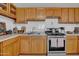 Close-up of the kitchen showing stainless steel oven and sink with granite countertops at 1815 E Illini St, Phoenix, AZ 85040