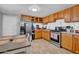 Functional kitchen with wooden cabinets, stainless steel appliances, and ample counter space at 1815 E Illini St, Phoenix, AZ 85040