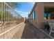Landscaped backyard featuring a gravel path, plants and desert shrubs and seating area at 18414 W La Mirada Dr, Goodyear, AZ 85338