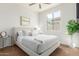 Well-lit bedroom features comfortable decor and lots of natural light from outdoor views at 18414 W La Mirada Dr, Goodyear, AZ 85338