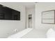 Bright bedroom features a TV, white walls, and a convenient closet with sliding doors at 18414 W La Mirada Dr, Goodyear, AZ 85338