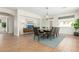Open dining area features a large window, modern lighting, and easy access to other rooms at 18414 W La Mirada Dr, Goodyear, AZ 85338