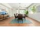 Spacious dining room with stylish lighting, natural light, and tile floors at 18414 W La Mirada Dr, Goodyear, AZ 85338