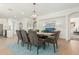 Elegant dining room with a modern chandelier, comfortable seating, and an open layout at 18414 W La Mirada Dr, Goodyear, AZ 85338