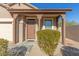 Inviting front entry with covered porch and neat landscaping adds curb appeal to this charming home at 18414 W La Mirada Dr, Goodyear, AZ 85338