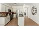 Functional kitchen with stainless steel appliances, island and tiled floors at 18414 W La Mirada Dr, Goodyear, AZ 85338