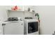 Laundry room with modern washer and dryer units and shelf space for storage at 18414 W La Mirada Dr, Goodyear, AZ 85338