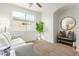Well-lit living room features a large window, plush carpet and cozy seating at 18414 W La Mirada Dr, Goodyear, AZ 85338