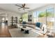 Stylish living room with comfortable seating, large windows, and contemporary decor at 18414 W La Mirada Dr, Goodyear, AZ 85338