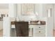 Cozy office nook with granite countertops and white cabinets provides a perfect work-from-home space at 18414 W La Mirada Dr, Goodyear, AZ 85338