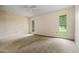 Bedroom featuring plush carpets, light walls, and windows to let in natural light at 19053 N Lakeforest Dr, Sun City, AZ 85373