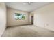 Bedroom with plush carpeting, window, and closet at 19053 N Lakeforest Dr, Sun City, AZ 85373