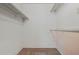 Walk-in closet with carpeted floor and built-in shelving at 19053 N Lakeforest Dr, Sun City, AZ 85373