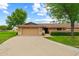 Charming home with well-kept landscaping, large driveway, and attached garage at 19053 N Lakeforest Dr, Sun City, AZ 85373
