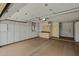Spacious garage featuring built-in cabinets for ample storage at 19053 N Lakeforest Dr, Sun City, AZ 85373