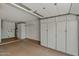 Finished garage featuring additional storage and utility sink at 19053 N Lakeforest Dr, Sun City, AZ 85373