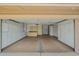Attached garage with custom built in cabinets for storage and workbench at 19053 N Lakeforest Dr, Sun City, AZ 85373