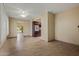 Inviting living room with neutral paint, tiled floors and view of kitchen at 19053 N Lakeforest Dr, Sun City, AZ 85373
