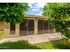 Enclosed back patio with sliding glass doors, creating a seamless indoor-outdoor living space at 19053 N Lakeforest Dr, Sun City, AZ 85373