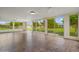 Bright sunroom with tiled floors and beautiful views of the backyard at 19053 N Lakeforest Dr, Sun City, AZ 85373