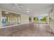 Bright sunroom with tile flooring and large windows offering backyard views at 19053 N Lakeforest Dr, Sun City, AZ 85373