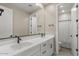 Bright bathroom featuring double sinks, undermount cabinet storage and sleek fixtures at 1906 N 140Th Dr, Goodyear, AZ 85395