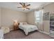 Bedroom featuring a ceiling fan and natural light at 1906 N 140Th Dr, Goodyear, AZ 85395