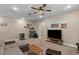 Cozy living room showcasing recessed lighting, neutral color palette, and comfortable seating at 1906 N 140Th Dr, Goodyear, AZ 85395