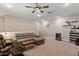 Cozy living room showcasing recessed lighting and comfortable seating at 1906 N 140Th Dr, Goodyear, AZ 85395