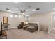 Bright living room offering recessed lighting, neutral color palette, and comfortable seating at 1906 N 140Th Dr, Goodyear, AZ 85395