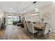 Bright and open living area with a modern kitchen, dining space, and comfortable seating at 1906 N 140Th Dr, Goodyear, AZ 85395