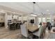 Bright and open living area with a modern kitchen, dining space, and comfortable seating at 1906 N 140Th Dr, Goodyear, AZ 85395