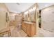 Bathroom features a large walk-in shower, double sinks and a walk-in closet at 19215 N Concho Cir, Sun City, AZ 85373