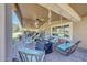 Relaxing covered patio with comfortable lounge furniture and swing to enjoy outdoor living at 19215 N Concho Cir, Sun City, AZ 85373