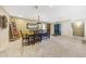 Bright dining room with a wooden table, chairs, travertine tile flooring and decorative accents at 19215 N Concho Cir, Sun City, AZ 85373