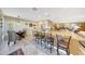 Bright kitchen featuring a breakfast bar with seating, an adjacent breakfast nook, and modern appliances at 19215 N Concho Cir, Sun City, AZ 85373