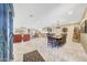 Spacious open-concept living and dining area with tile flooring, stylish decor, and lots of natural light at 19215 N Concho Cir, Sun City, AZ 85373