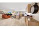 Bright living space with travertine floors, kitchen with wooden cabinets, and neutral walls at 19215 N Concho Cir, Sun City, AZ 85373