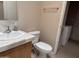Bathroom sink and toilet with a nearby washing machine at 201 S Greenfield S Rd # 222, Mesa, AZ 85206