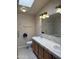 Well-lit bathroom features a double sink vanity, neutral tile, and ample counter space at 201 S Greenfield S Rd # 222, Mesa, AZ 85206