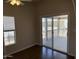 Bright bedroom features wood floors and sliding door access to a private deck at 201 S Greenfield S Rd # 222, Mesa, AZ 85206
