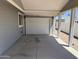Spacious carport with a secure garage door and ample parking, offers shade and protection from the elements at 201 S Greenfield S Rd # 222, Mesa, AZ 85206