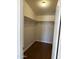 Walk-in closet with wood floor and shelf at 201 S Greenfield S Rd # 222, Mesa, AZ 85206
